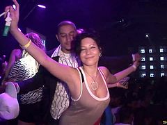 Sexy brunette with a curvy body flashing her big tits in public