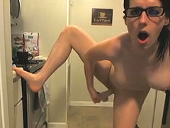 This busty webcam model knows how to turn up the head in the kitchen