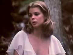 Lustful babe Kristine DeBell is masturbating passionately in the woods