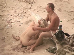 Voyeur sex video from the public beach with hot couple