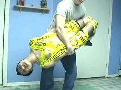 Petite and skinny pale skin Asian chick wrapped in tape