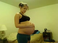 Beautiful pregnant GF stripping seductively on camera